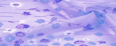 Arkaplan deseni, ipek kumaş, eflatun arkaplanda küçük çiçekler, baskılı ince bir gök mavisi rengi. Çiçek tasarımı