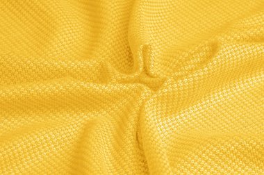 Arka plan dokusu, desen Kumaş dikilmiş sarı iplik ile sıcak yün. Bizim sarı yün örme ile gerçek şeritler gösterin. Parlak, eklektik renklere sahip, bohem bir görünüm sızdırıyor.