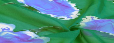 Doku, arkaplan, mavi çiçekli yeşil ipek kumaş. Projeleriniz stüdyomuzda son ürünlerini kullanma konusunda derin bilgiye sahip tasarımcılar tarafından geliştirildi..