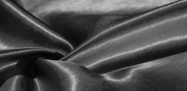 Doku, arkaplan, desen, siyah ipekten kumaş. Bu sevimli, yumuşak ve parlak kumaşın pürüzsüz bir vizon yüzeyi var. Projelerinizi yaratmak için mükemmel..