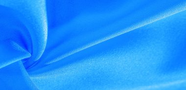 Doku, arkaplan, desen, mavi ipekten kumaş. Bu ipek inanılmaz derecede zarif. Bundan elde edilen projeler uzun süre devam edecek ve hala oldukça iyi durumda olacak..