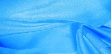 Doku, arkaplan, desen, mavi ipekten kumaş. Bu ipek inanılmaz derecede zarif. Bundan elde edilen projeler uzun süre devam edecek ve hala oldukça iyi durumda olacak..