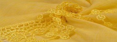 Doku, arkaplan, desen, kartpostal, ipek kumaş, dantel ambalajlı kadın sarı atkısı. Yazdırma ve dijital materyallerinizi oluşturmak için bu süslü resimleri kullanın.