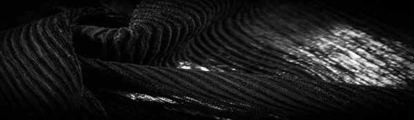 褶皱黑色 是一种丝绸 羊毛或合成纤维的织物 具有明显的清晰 弯曲的外观 — 图库照片