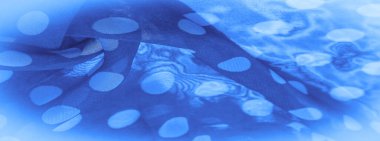 Arkaplan dokusu, dekoratif süs, mavi benekli ipek kumaş, kumaşın şekli veya silindiri andıran yuvarlak noktalar..