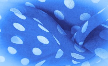 Arkaplan dokusu, dekoratif süs, mavi benekli ipek kumaş, kumaşın şekli veya silindiri andıran yuvarlak noktalar..