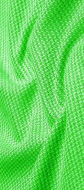 Arka plan dokusu, desenli kumaş, dikişli yeşil iplikli sıcak yün. Klasiklerden etkilenenler için zeytin, yeşil ve zümrütle harmanlanmış bu bağbozumundan esinlensinler.