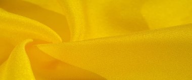 Doku arka plan deseni, sarı kumaş ipek. Krep saten arka tasarım için mükemmel bir kumaş, bir yandan bir saten bitirmek ve diğer - krep, hangi geri dönüşümlü hale getirir