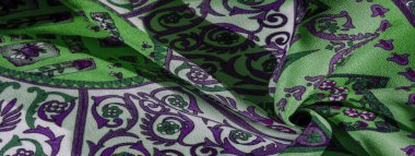 Doku arkaplan deseni, ipek kumaş, ılımlı yatıştırıcı renkler, kraliyet monogram deseni, kumaşta beyaz, yeşil masmavi renkler. Tasarımınız Orta Çağ ruhuna uygun olacak.