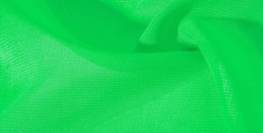 doku arka plan desen yeşil ipek kumaş. Bu ipek organze nazik bir açık diş vardır. Bu lüks kumaşı, özel günler için tasarımınızdan projelerinizi oluşturmaya kadar her şey için kullanın.