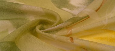 Doku, arka plan, büyük desenli ince yarı saydam ipek. Sarı bir arka plan üzerinde - marul ve turuncu çiçekler, genel kompozisyon biraz soyut kılan kendi desen, her biri ile.