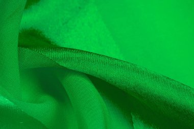 Doku, arkaplan, metalik parıltılı yeşil ipek çizgili kumaş. Eğer kötü bir ruh halin varsa, bu kumaş onu eşi görülmemiş yüksekliklere taşıyacaktır. Projeniz başarılı olacak..