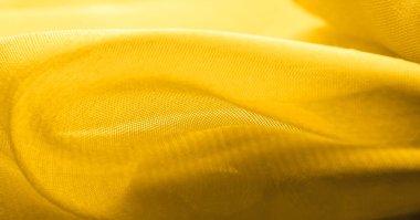 Arka plan dokusu, desen. Metalik pullu sarı kumaş. Bu güzel, hafif pullu kumaşın notaları, pullu aksanı ve güzel bir tasarımı var. Ayrıca güzel bir parıltısı var..