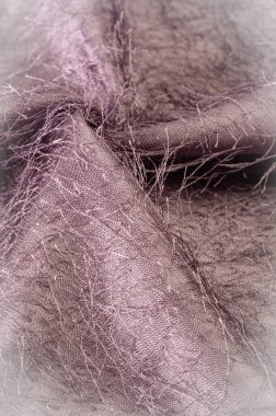 Arkaplan dokusu, dekoratif süs, kahverengi ipek kumaş, kumaşta dokuma iplikleri, kabarık efekt, his, görünüş veya bir yüzey veya maddenin dokusu.