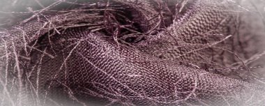 Arkaplan dokusu, dekoratif süs, kahverengi ipek kumaş, kumaşta dokuma iplikleri, kabarık efekt, his, görünüş veya bir yüzey veya maddenin dokusu.