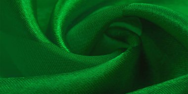 Doku, arkaplan, metalik parıltılı yeşil ipek çizgili kumaş. Eğer kötü bir ruh halin varsa, bu kumaş onu eşi görülmemiş yüksekliklere taşıyacaktır. Projeniz başarılı olacak..