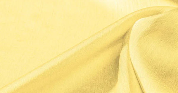 Background, pattern, texture, wallpaper, yellow silk fabric. It has a smooth matte finish. Use this luxurious fabric for anything - from design to your projects. The possibilities are truly endless!