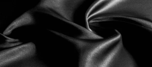 texture, background, pattern. Black silk fabric. It is black and heat resistant with gray. Transform its tougher drape into a design for any event. It is a crispy, lightly textured hand.