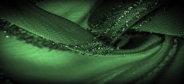 Doku arkaplan resmi. Kumaş şeffaf zümrüt yeşili. Parlak doğuştan gelen çizgileri var..