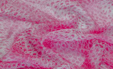 Beyaz kırmızı rengin dokusu, arkaplanı, deseni, ipek kumaşı tekstil. Özellikleri, daha esnek ve tasarlanması daha kolay olduğu için dokuma malzemesinden farklıdır..