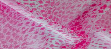 Beyaz kırmızı rengin dokusu, arkaplanı, deseni, ipek kumaşı tekstil. Özellikleri, daha esnek ve tasarlanması daha kolay olduğu için dokuma malzemesinden farklıdır..