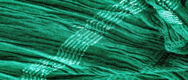 Arka plan resminin dokusu suyun altındaki kumaşın rengi, yeşil-mavi kıvrımlı kumaş, paralel veya çapraz kıvrımlı, tırtıklı katlı kumaş; böyle bir kumaştan çıkan ürünler..