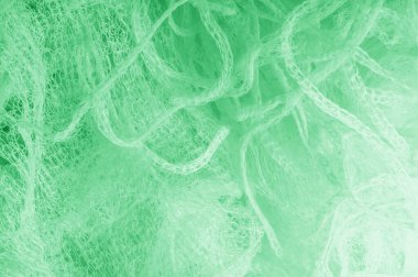 Örgü yeşilli kumaş. Dekorasyon ve tasarım için ruhani parlaklık bir çizgi ekleyin, bu kumaş zengin, zengin ve parlak bir ton vermek için iplikleri içine küçük ışıltılar Ton glitter.