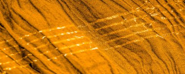 Arkaplan deseninin dokusu, süs süsü, altın sarısı kıvrımlı kumaş, paralel ya da çapraz kıvrımlı kumaş; böyle bir kumaştan çıkan ürünler.