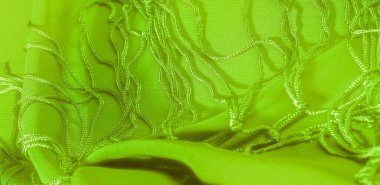 İpek kumaşın arka plan dokusu. Bu doğal yeşil salata eşarbı, şeffaf eli olan yapay ipekten yapılmış bu güzel naylon saten ve harika bir parıltı projeleriniz için mükemmel..
