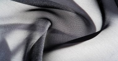 Arkaplan, desen, doku, duvar kağıdı, siyah ipek kumaş. Herhangi bir tasarıma biraz lüks katarak, bu aşırı yumuşak ve hafif polyester astarlı kumaşa yerleştirin..