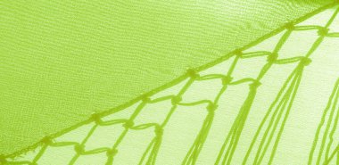 İpek kumaşın arka plan dokusu. Bu doğal yeşil salata eşarbı, şeffaf eli olan yapay ipekten yapılmış bu güzel naylon saten ve harika bir parıltı projeleriniz için mükemmel..