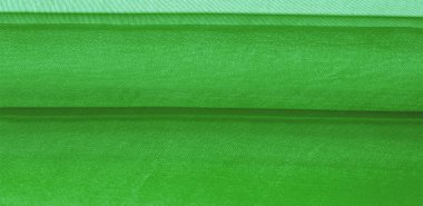 Yeşil ipek kumaş dokusu. Tasarımınız, giysileriniz ve posterleriniz için de mükemmel. Güzel proje aksanlarıyla yaratıcı ol. Bu kumaş senin ilham kaynağın..