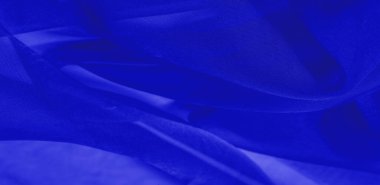 Mavi ipek kumaş dokusu. Tasarımınız, giysileriniz ve posterleriniz için de mükemmel. Güzel proje aksanlarıyla yaratıcı ol. Bu kumaş senin ilham kaynağın..