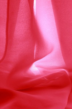 doku arkaplan deseni. İnce bir mat parıltısı olan kırmızı ipek kumaş. Dizaynınız, aksanınız, duvar kağıtlarınız, posterleriniz ve kartpostallarınız için mükemmel..