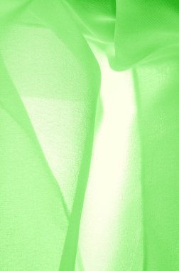 doku arkaplan deseni. İnce bir mat parıltısı olan yeşil ipek kumaş. Dizaynınız, aksanınız, duvar kağıtlarınız, posterleriniz ve kartpostallarınız için mükemmel..