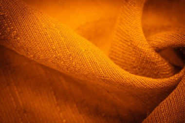 Arkaplan resminin dokusu, süsün dekoru, sarı sentlik ipek kumaşın sıcak rengi, dekoratif elementler ekleyerek bir şeyi daha çekici hale getirebilirsiniz.