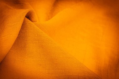 Arkaplan resminin dokusu, süsün dekoru, sarı sentlik ipek kumaşın sıcak rengi, dekoratif elementler ekleyerek bir şeyi daha çekici hale getirebilirsiniz.