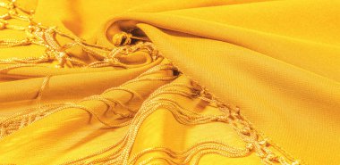 İpek kumaş Arka plan dokusu. Bu doğal sarı bir eşarp, şeffaf bir el ve harika bir sheen ile rayon yapılmış bu güzel naylon saten projeleriniz için mükemmel.