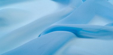 doku arkaplan deseni. Mavi ipek kumaş. Hafif bir yapay ipek kumaş. Dupioni kumaşı. Tasarımınız, aksanınız, duvar kağıtlarınız, posterleriniz ve kartlarınız için mükemmel..