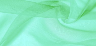 Yeşil ipek kumaş dokusu. Tasarımınız, giysileriniz ve posterleriniz için de mükemmel. Güzel proje aksanlarıyla yaratıcı ol. Bu kumaş senin ilham kaynağın..