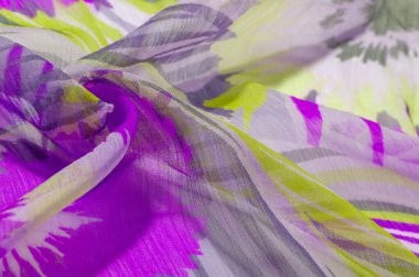 doku arkaplan deseni. Renkli dantelli ipek kumaş. Sarı mavi ve gri-mavi gözlükler. Dizaynınız, aksanınız, duvar kağıtlarınız, posterleriniz ve kartpostallarınız için mükemmel. Olasılıkların sonsuz.