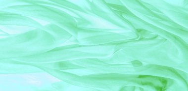 Yeşil ipek kumaş dokusu. Tasarımınız, giysileriniz ve posterleriniz için de mükemmel. Güzel proje aksanlarıyla yaratıcı ol. Bu kumaş senin ilham kaynağın..