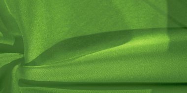 Doku, arka plan, desen, ipek yeşil kumaş. Krep saten arka tasarım için mükemmel bir kumaş, bir yandan bir saten bitirmek vardır, ve diğer - krep, hangi geri dönüşümlü hale getirir,