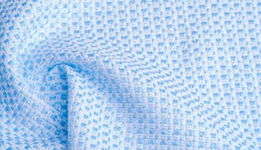 Doku, kumaş, desen. Büyük mavi beyaz iplikler, çok basit bir dokuma ve çok az parıltıyla sıkıca örülmüş kumaş, bu da onu güzel ve profesyonel yapar..