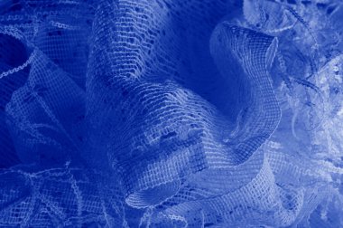 Doku, arka plan mavi tül. Bu olağanüstü naylon tülü kullanarak bir aksesuara hacim, yetenek ya da detaylı tasarım ayrıntıları ekleyin! Yumuşak tül tasarım gereksinimlerinizi karşılıyorsa, diğer kalıplara bakın