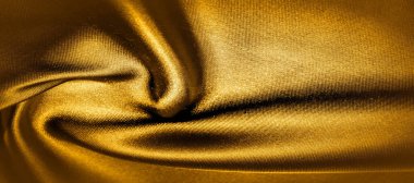 doku, arka plan, desen. altın sarısı ipek kumaş panoramik fotoğraf. Burası güneşli Carolina. Bu ince bir aydınlatma oluşturur pürüzsüz bir el. Lüks ipekten yapılmış, güzellik gibi.!