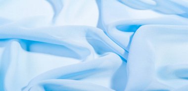 doku arkaplan deseni. Mavi ipek kumaş. Hafif bir yapay ipek kumaş. Dupioni kumaşı. Tasarımınız, aksanınız, duvar kağıtlarınız, posterleriniz ve kartlarınız için mükemmel..