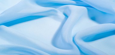 doku arkaplan deseni. Mavi ipek kumaş. Hafif bir yapay ipek kumaş. Dupioni kumaşı. Tasarımınız, aksanınız, duvar kağıtlarınız, posterleriniz ve kartlarınız için mükemmel..