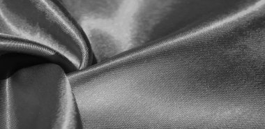 Doku, arkaplan, desen, siyah ipekten kumaş. Bu sevimli, yumuşak ve parlak kumaşın pürüzsüz bir vizon yüzeyi var. Projelerinizi yaratmak için mükemmel..