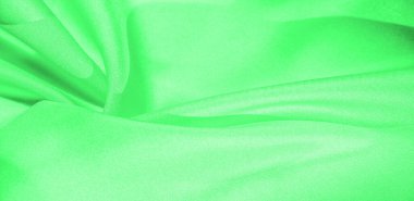 Doku, arka plan, desen, yeşil renk ipek kumaş. Bu ipek inanılmaz derecede zarif. Bu yapılan projeler uzun bir süre sürecek ve hala oldukça iyi durumda olacak.